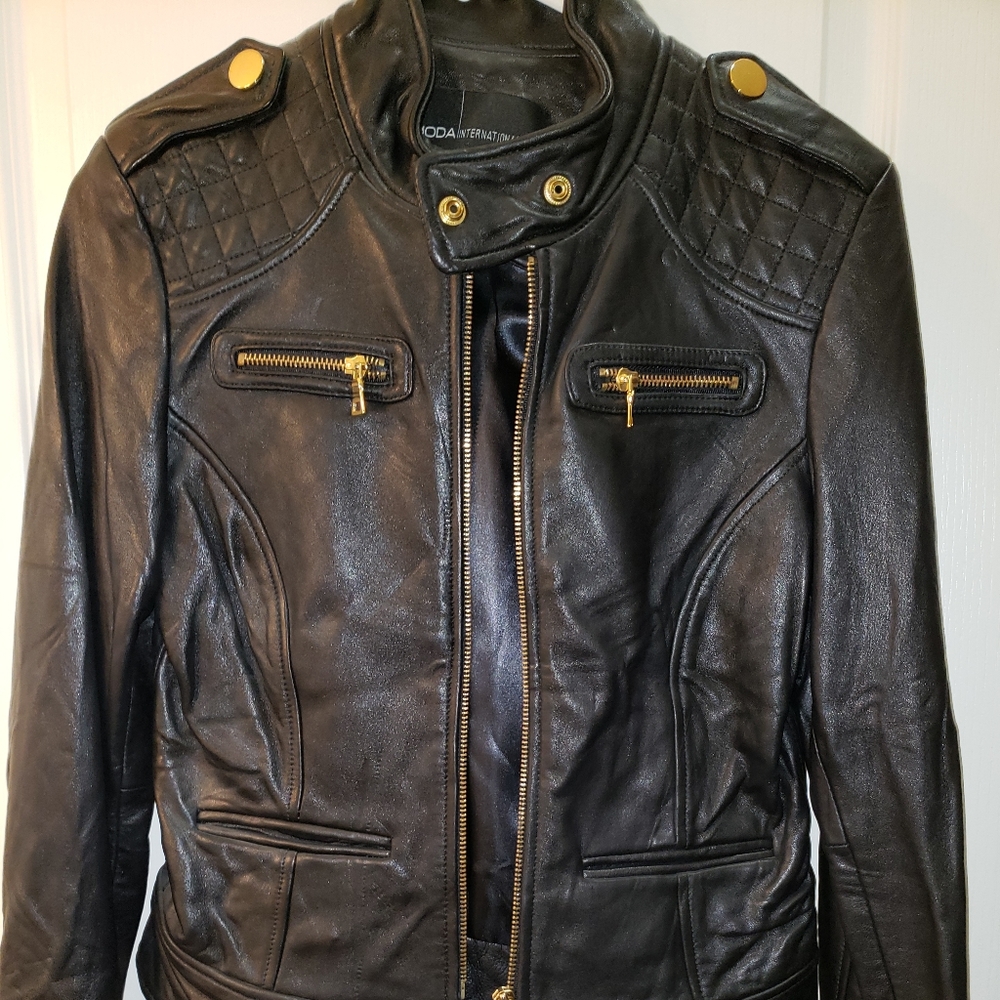 Black leather moto jacket with gold detail